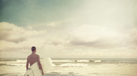 Surfer at daybreak