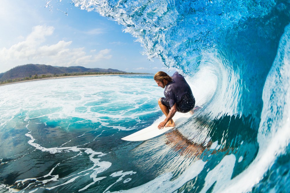 Blue water surfer