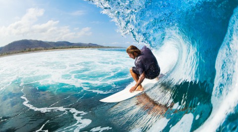 Blue water surfer
