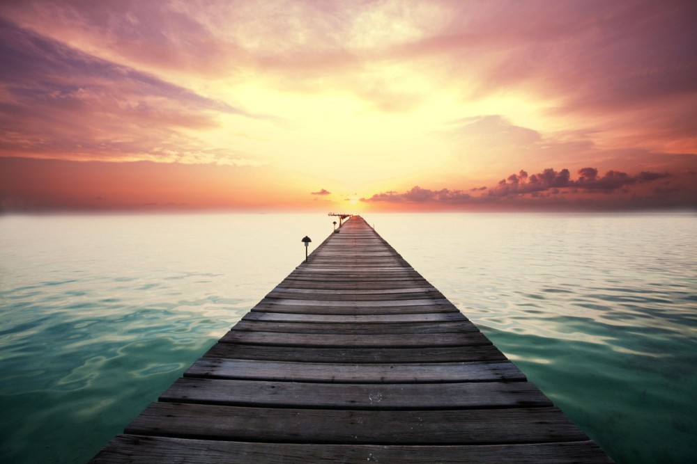 pier extending out into the sunset